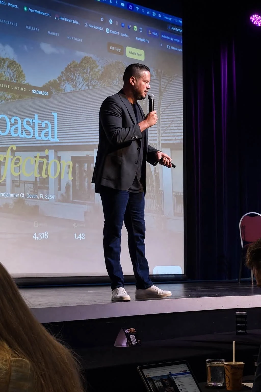 Anthony Cruz presenting a listing on stage