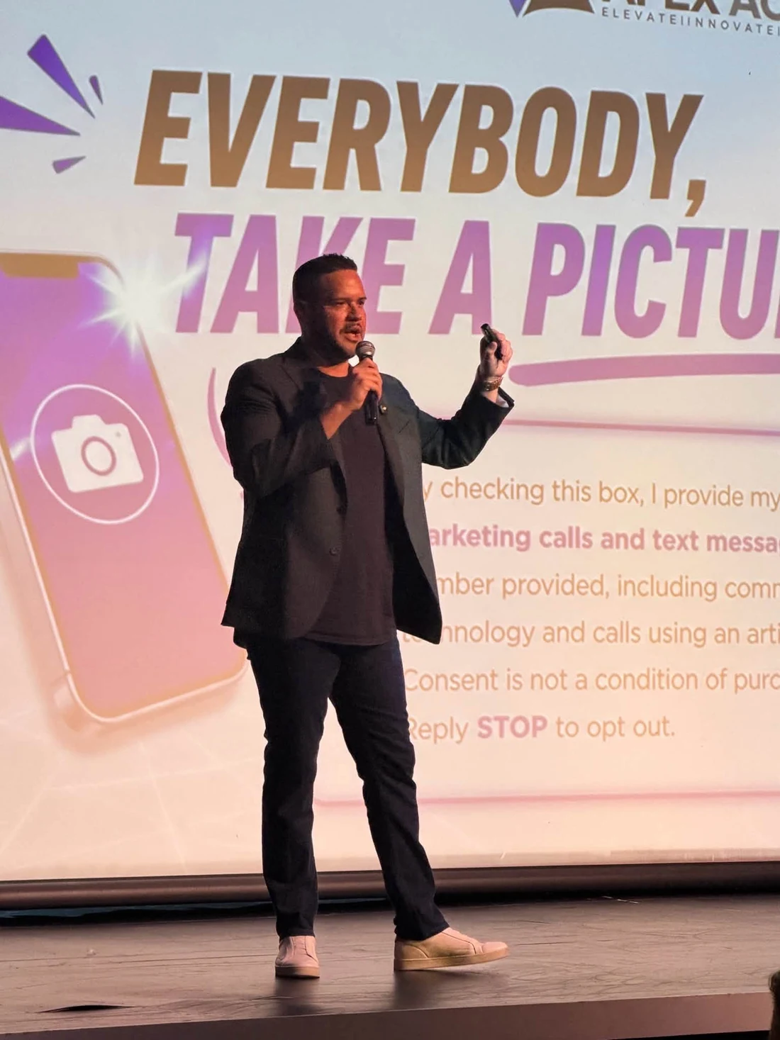 Anthony Cruz speaking on stage at an industry event